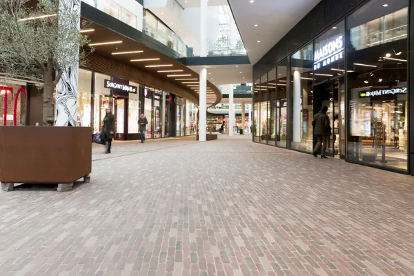 Subtle colour variations in the clay pavers create a warm ambience both inside and outside