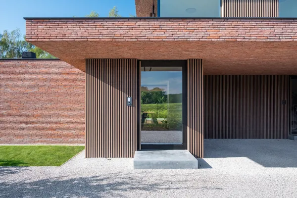 Brown-red Linea 3011 helps realise sleek lines of this contemporary NZE home