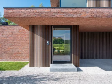 Brown-red Linea 3011 helps realise sleek lines of this contemporary NZE home