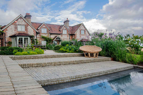 SeptimA Olive clay pavers give the terrace and pool area the desired texture