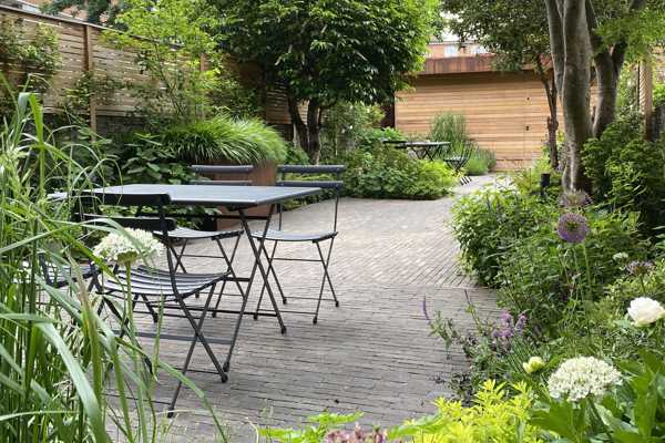 Taupe clay pavers give a contemporary look to this London city garden