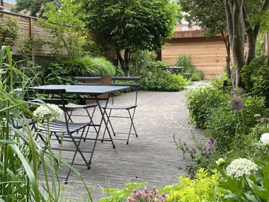 Taupe clay pavers give a contemporary look to this London city garden