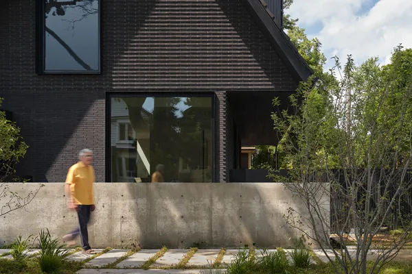 Dark facing bricks as a basis for compact yet spacious Toronto home