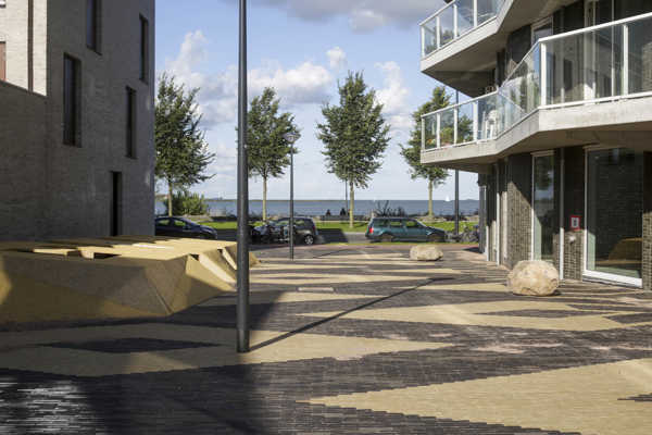 Contrasting pattern of SeptimA clay pavers bring colour to Kieke-Boe district square in Amsterdam
